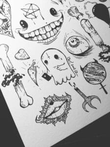 drawing of a ghost, mouth , candles, eyeballs, bones